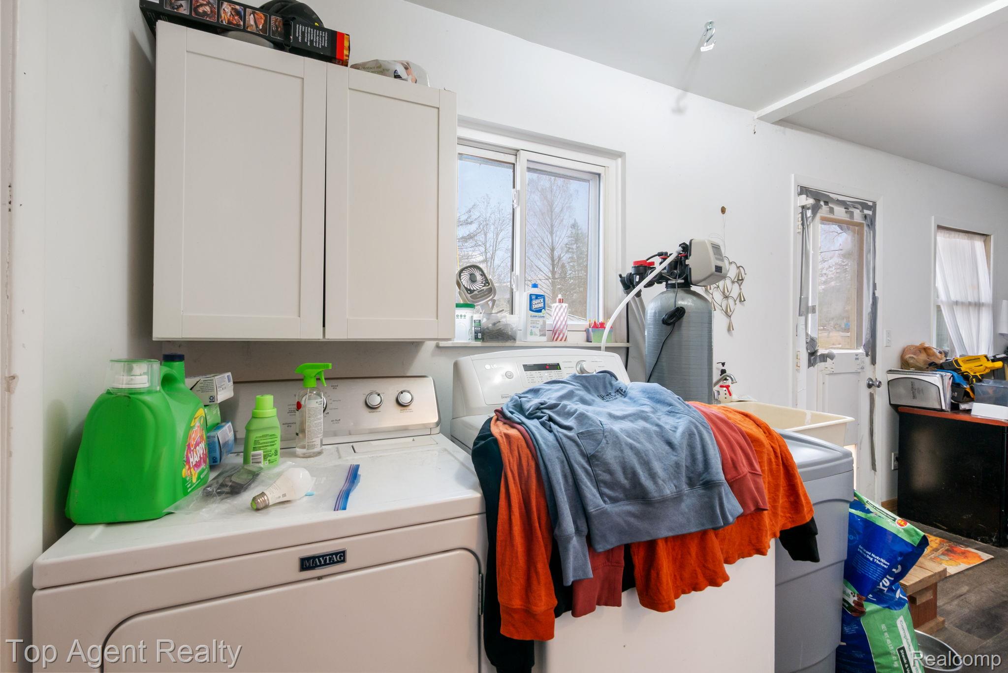 2065 Ridgemont Street Commerce Township, MI 48382 - Photo 24 of 35 Laundry area with separate washer and dryer and healthy amount of natural light
