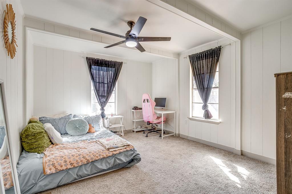 610 North Mesquite Hico, TX 76457 - Photo 26 of 34 a bedroom with a bed couch and window