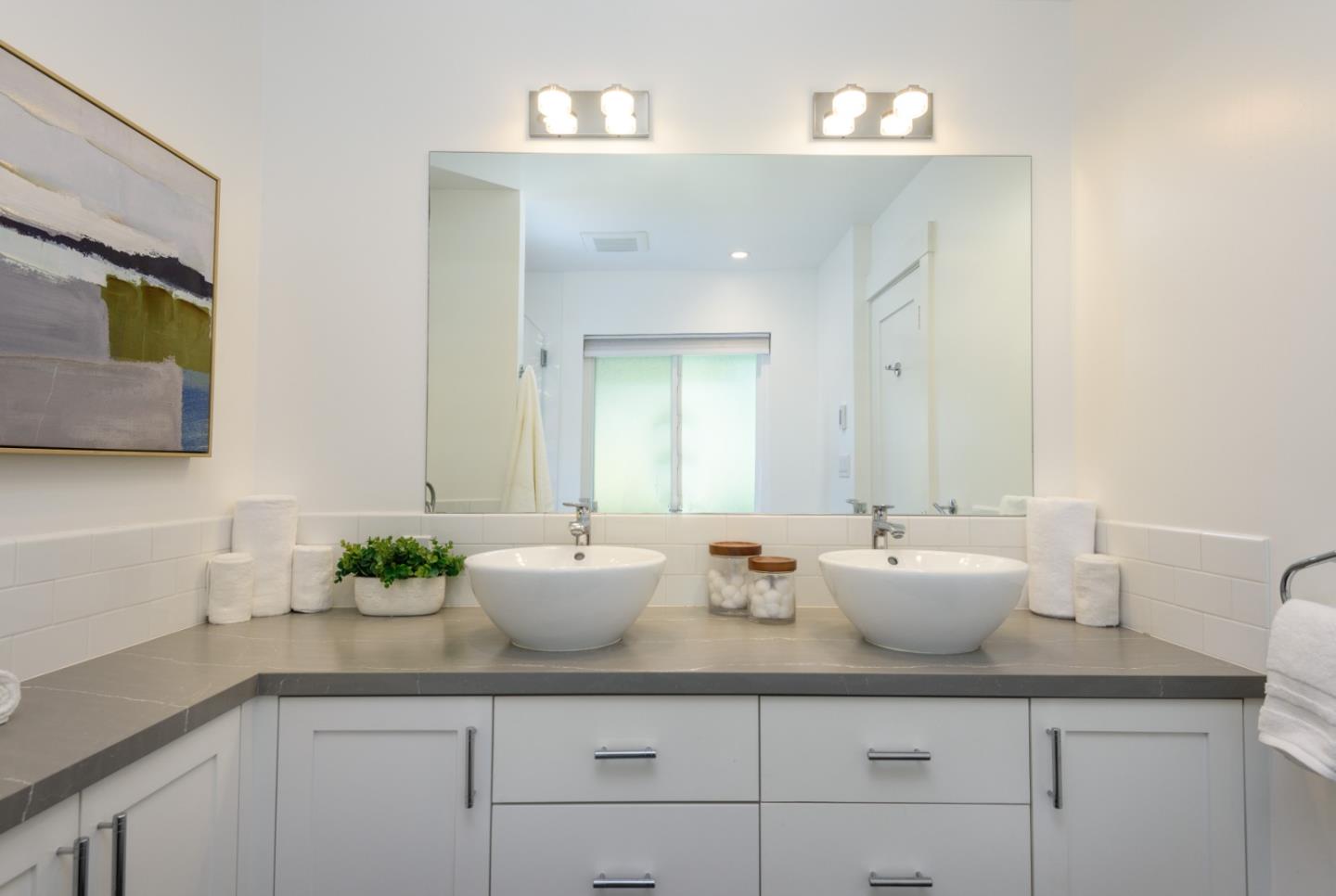 1990 Los Altos Drive San Mateo, CA 94402 - Photo 14 of 34 a bathroom with a granite countertop sink and a mirror