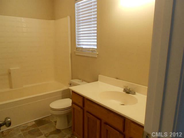 906 Treasure Place Southwest Concord, NC 28025 - Photo 12 of 15 a bathroom with a sink and a toilet