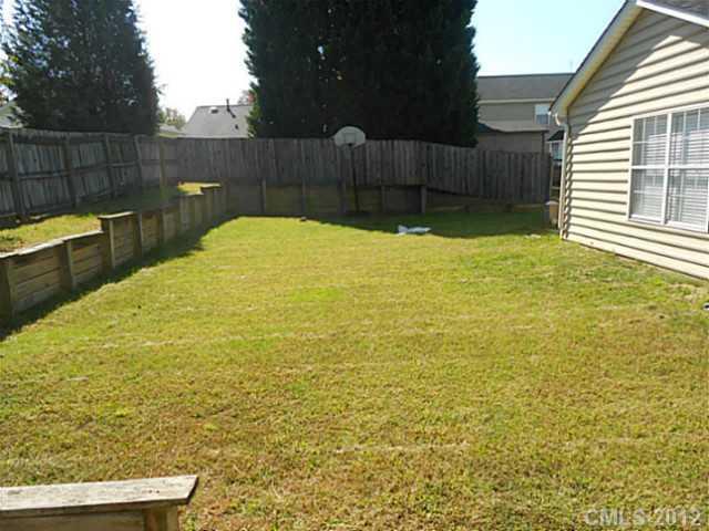 906 Treasure Place Southwest Concord, NC 28025 - Photo 15 of 15 a view of a swimming pool with a chair