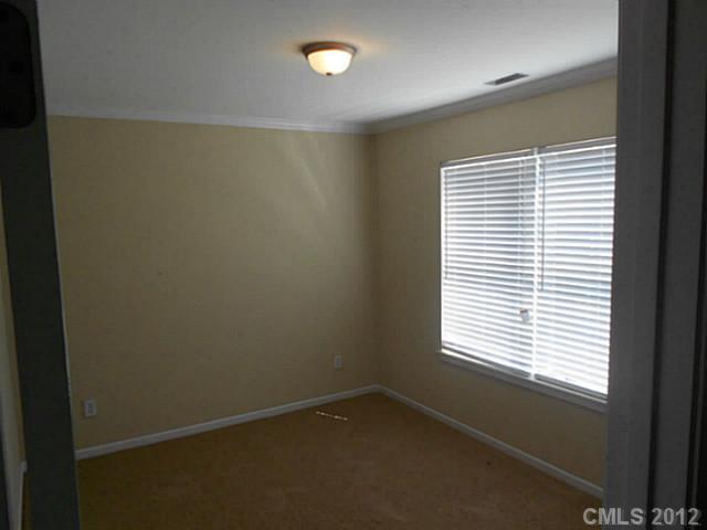 906 Treasure Place Southwest Concord, NC 28025 - Photo 7 of 15 a view of an empty room with a window
