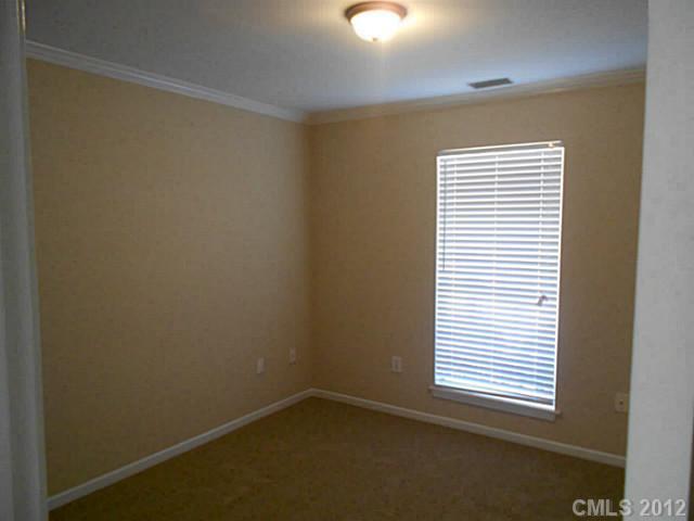 906 Treasure Place Southwest Concord, NC 28025 - Photo 10 of 15 an empty room with a window