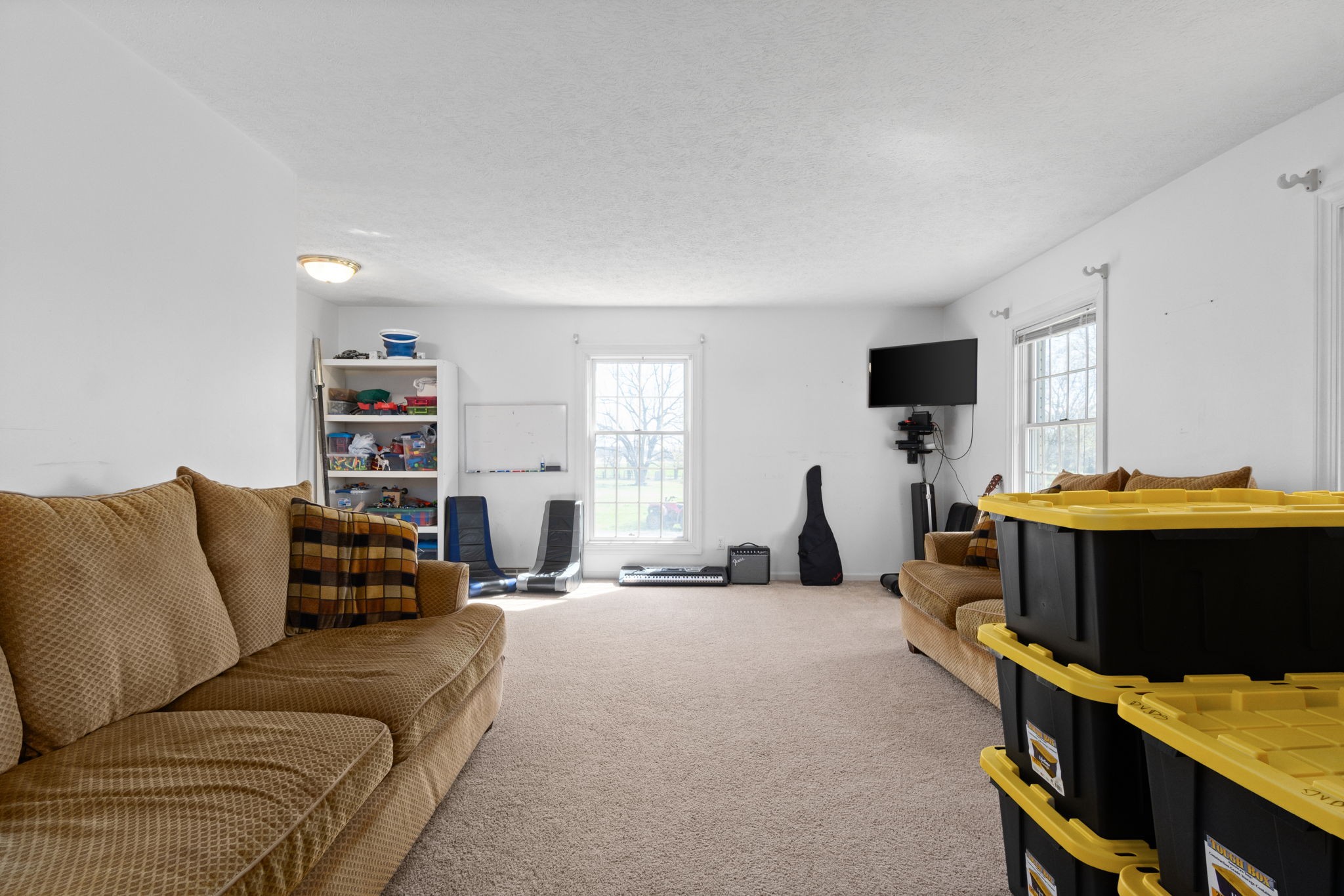 5150 Cadiz Road Hopkinsville, KY 42240 - Photo 6 of 45 a living room with furniture a window and a flat screen tv