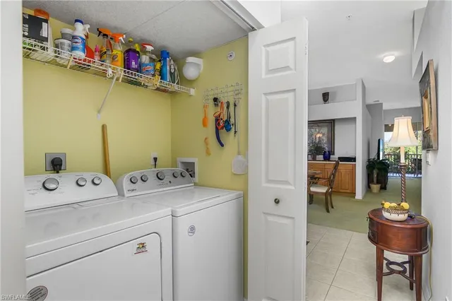 an aerial view of residential houses with outdoor space and river