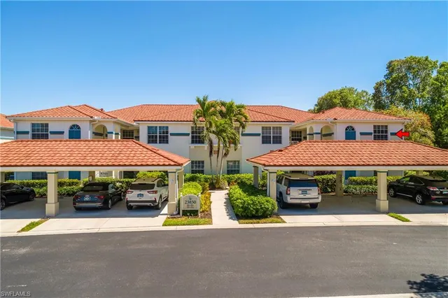 a kitchen with a stove a sink and a microwave