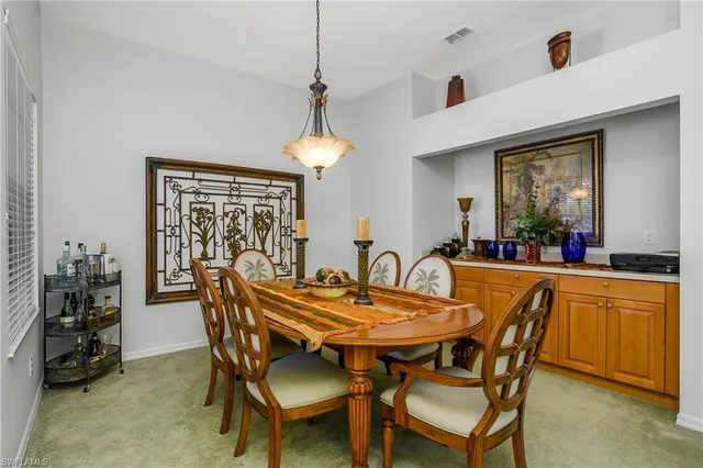 a dining room with furniture and window