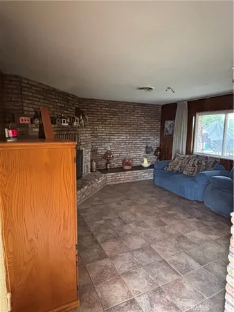 a view of a refrigerator in kitchen and utility room