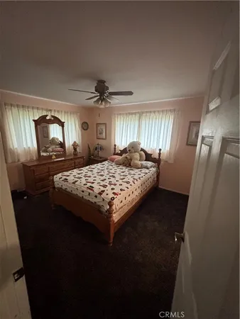 a bedroom with a bed and dresser