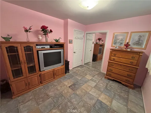 a view of a livingroom with furniture and flat screen tv