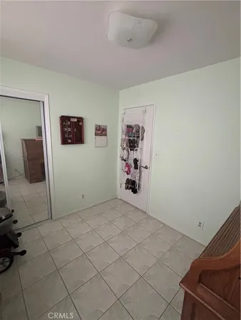 a view of a livingroom with shelves