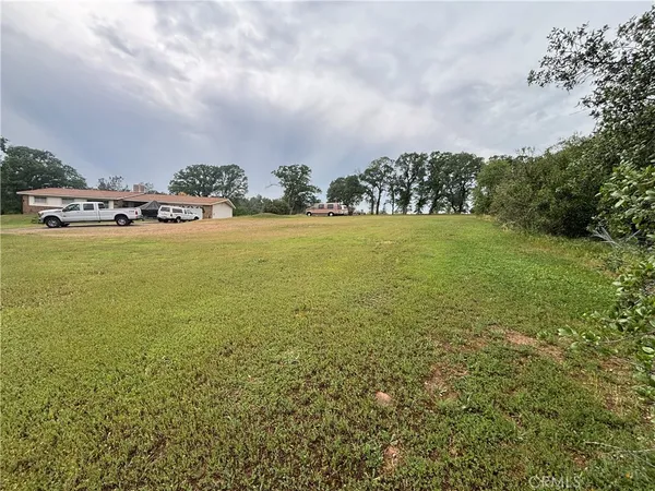a car parked in the middle of a field
