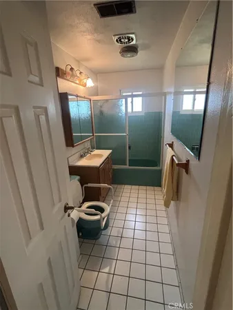 a view of a hallway with washer and dryer