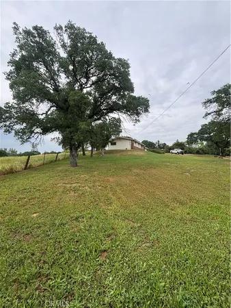 a view of a lake with houses in the back