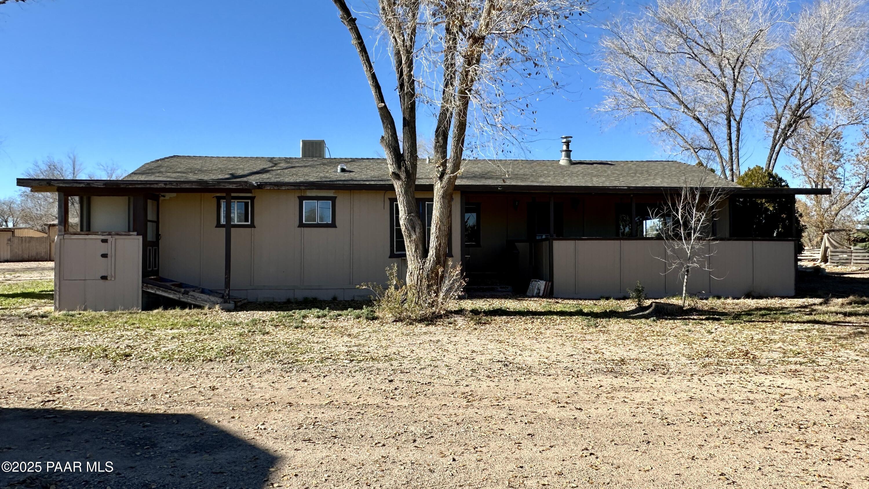 1331 East Red Cinder Road Chino Valley, AZ 86323 - Photo 1 of 58 a house with trees in the background