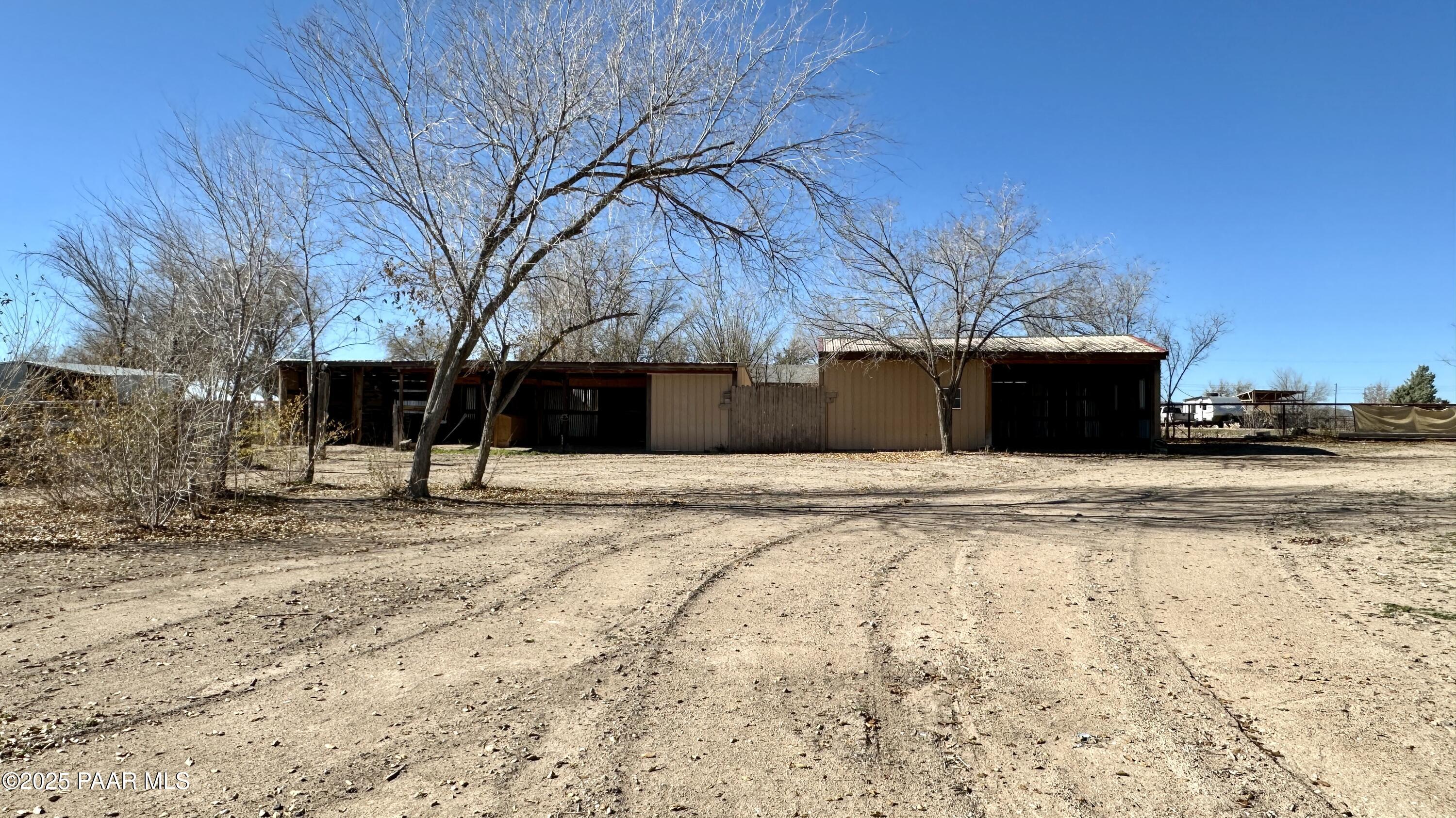 1331 East Red Cinder Road Chino Valley, AZ 86323 - Photo 41 of 58 a front view of a house with a yard