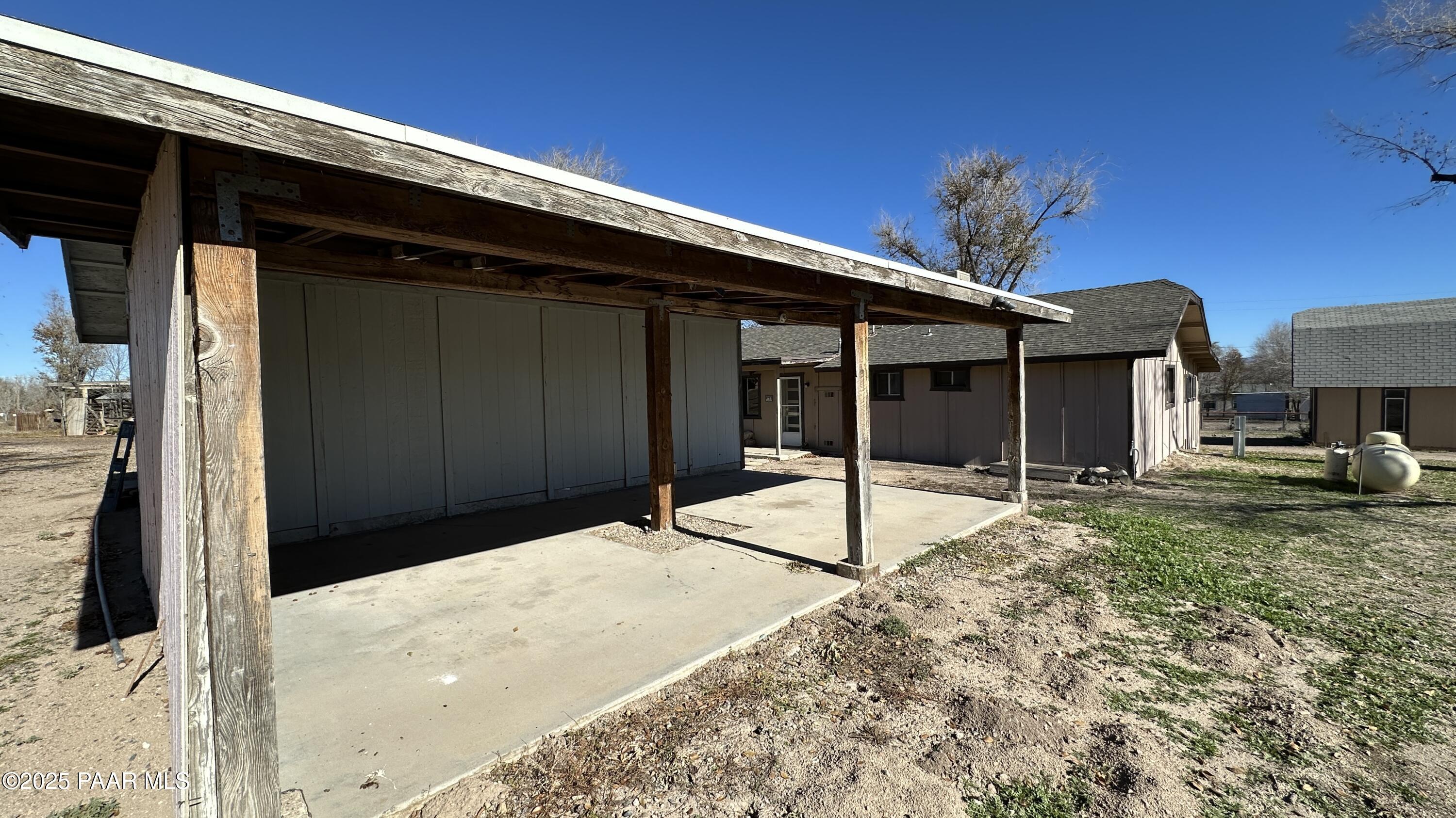1331 East Red Cinder Road Chino Valley, AZ 86323 - Photo 50 of 58 a house with a yard and seating space