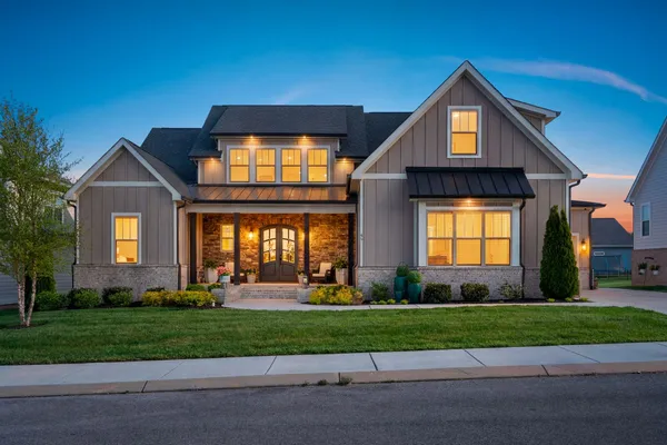 a front view of a house with a yard