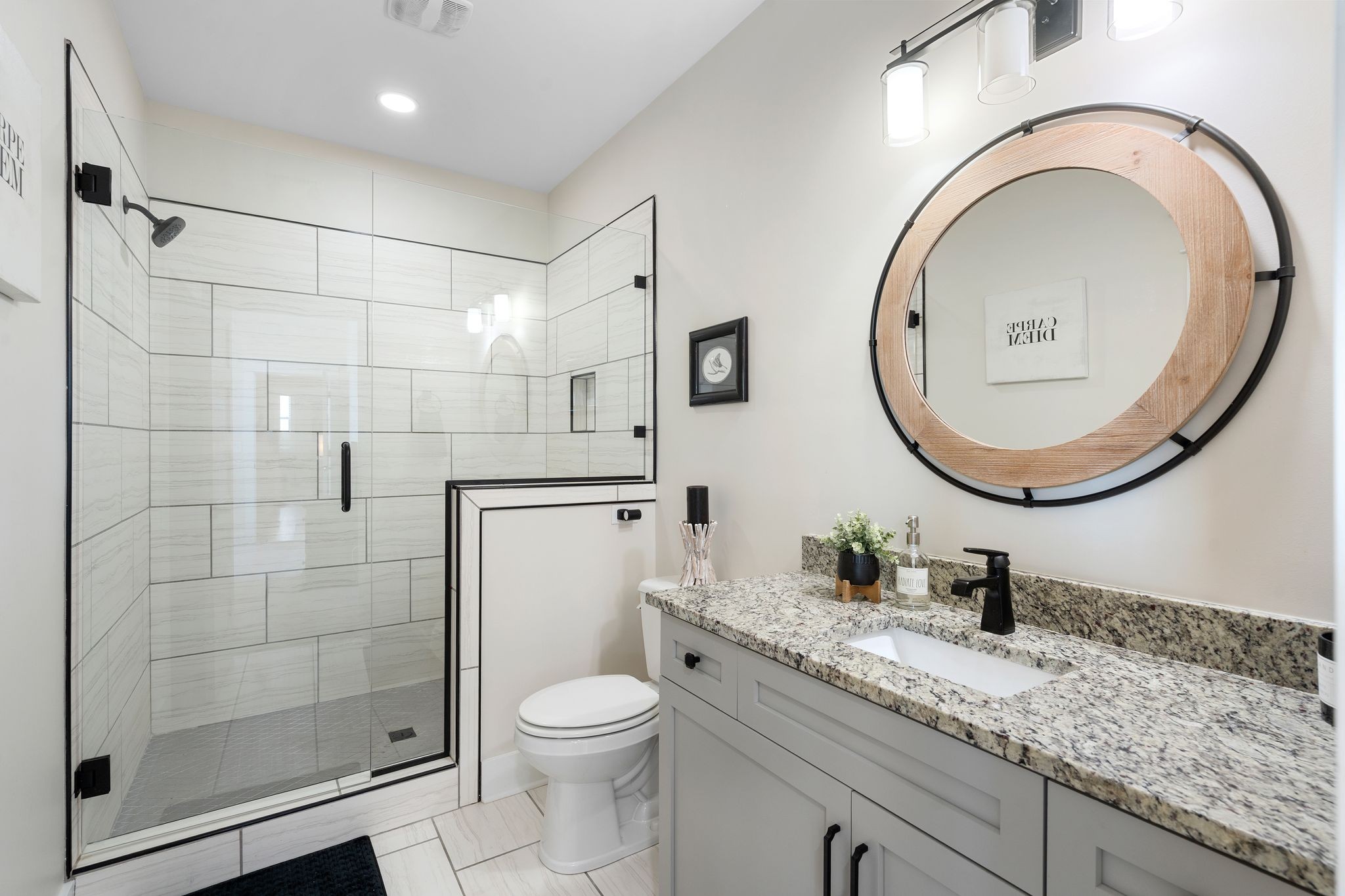 49 Why Worry Lane Winchester, TN 37398 - Photo 37 of 67 a bathroom with a granite countertop toilet a sink and a mirror