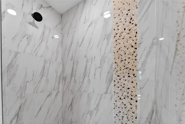 a bathroom with a toilet a sink and a mirror