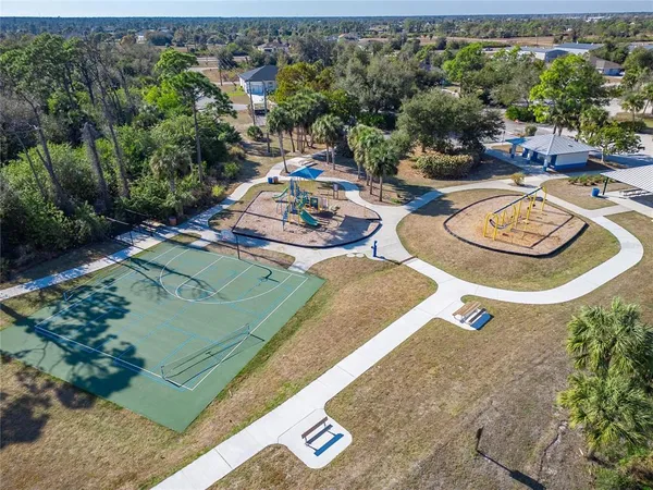 a view of a kitchen with a sink and a large window