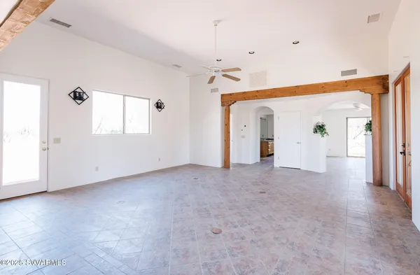 a view of empty room with ceiling fan
