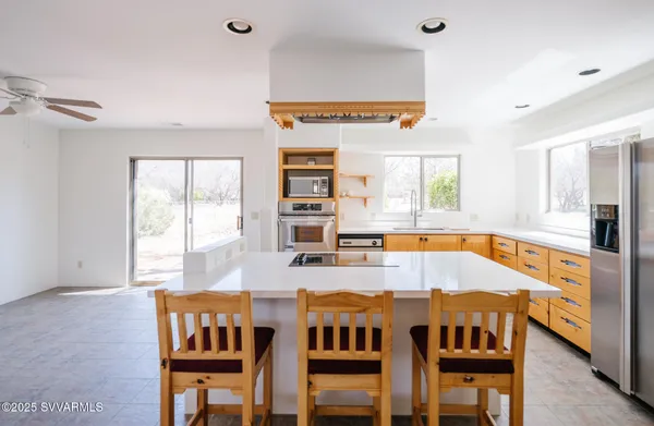 a kitchen with stainless steel appliances granite countertop a stove and a sink