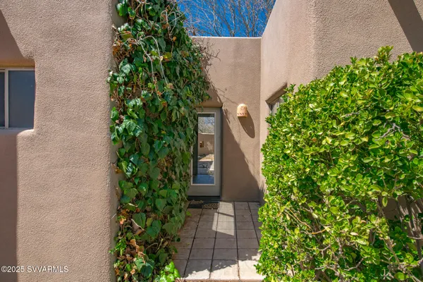 a backyard of a house with large trees