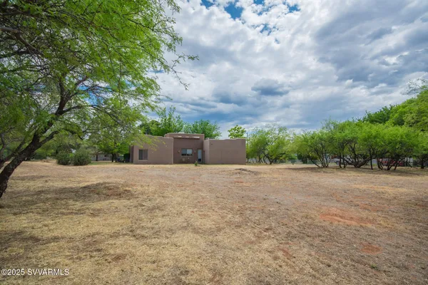 a view of a house with a yard and garage