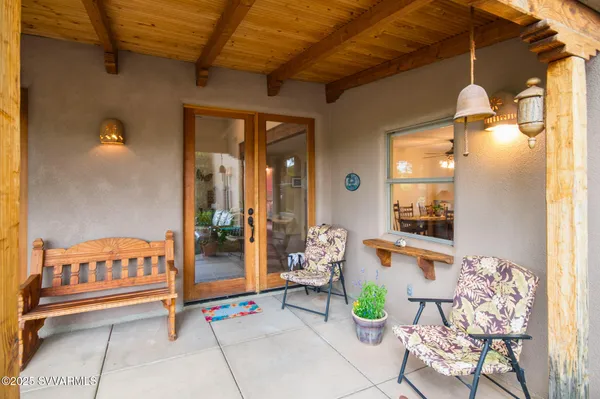a view of an empty room with closet and a window