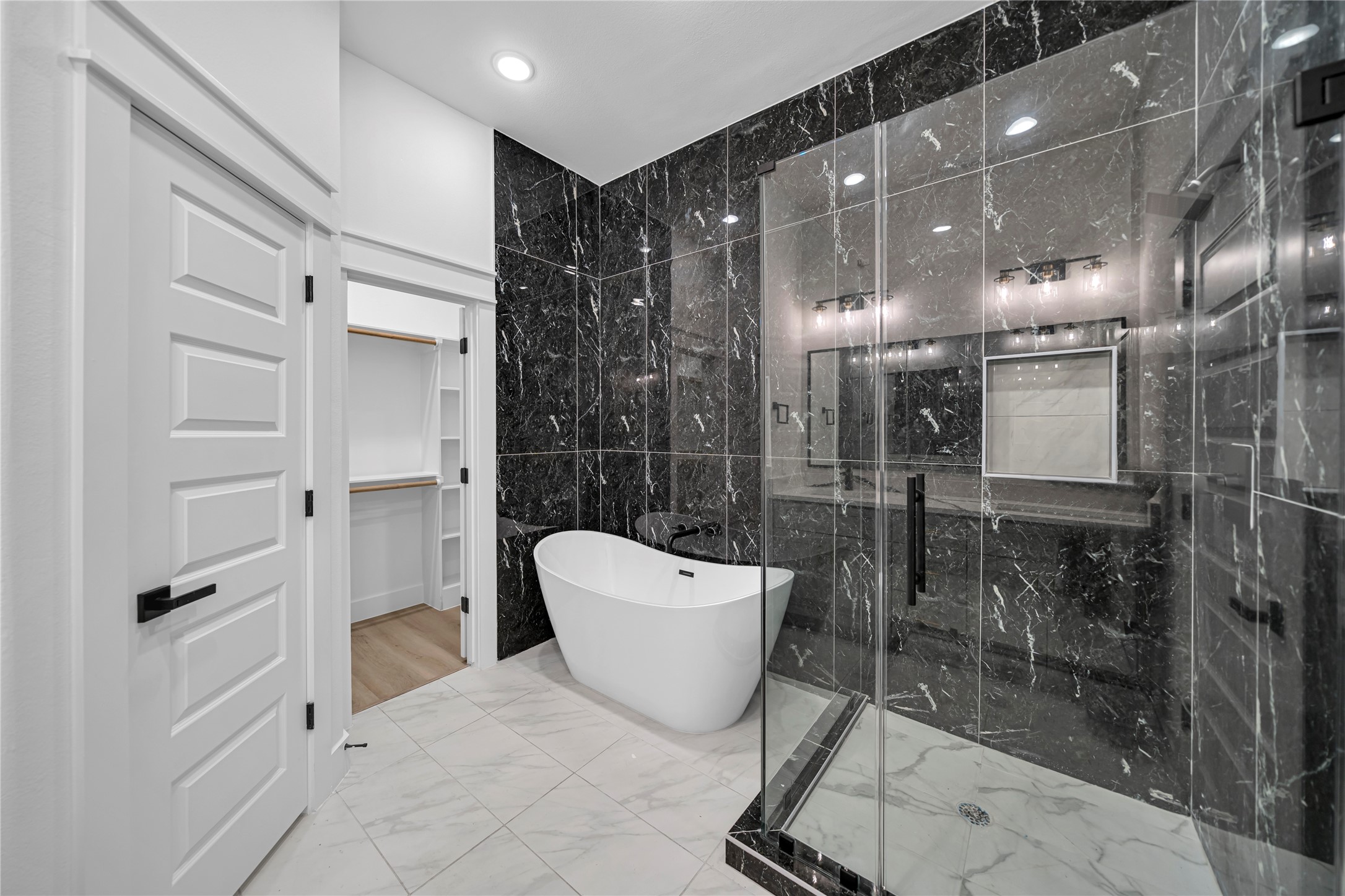 4834 Higgins Street, Unit B Houston, TX 77033 - Photo 15 of 34 a bathroom with a bathtub and shower