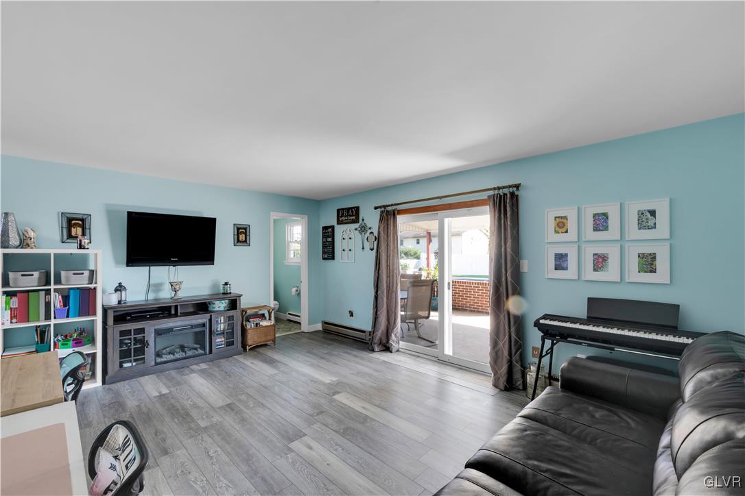 3248 Garrett Road Bethlehem, PA 18017 - Photo 19 of 40 a living room with furniture and a flat screen tv