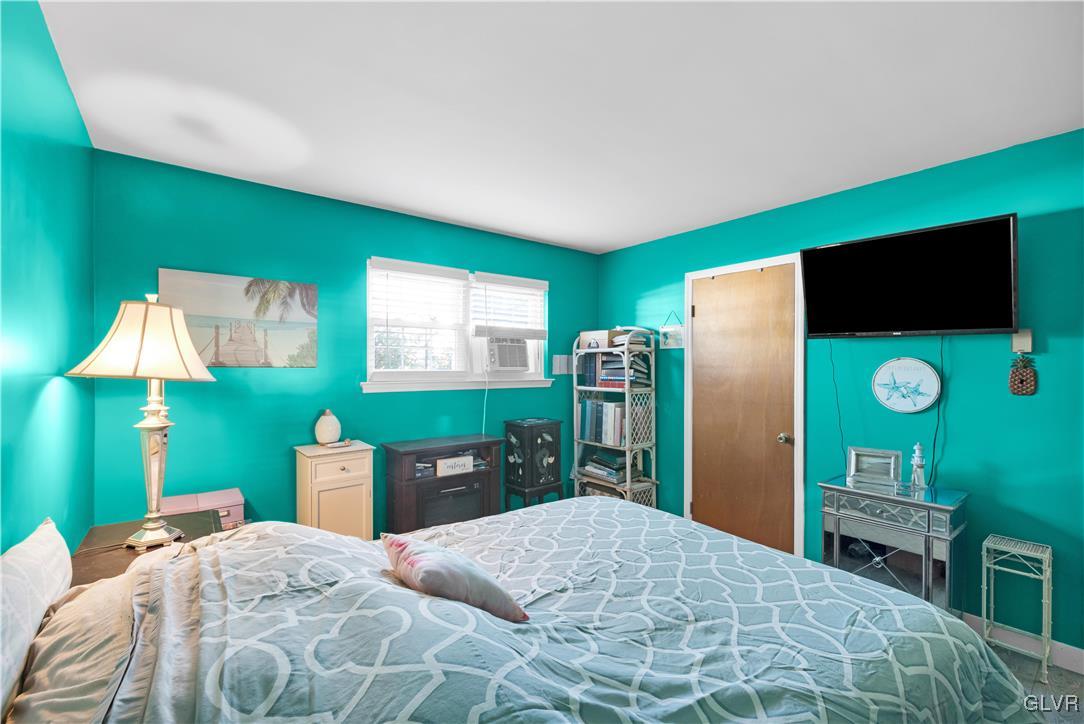 3248 Garrett Road Bethlehem, PA 18017 - Photo 22 of 40 a bedroom with a bed and a flat screen tv