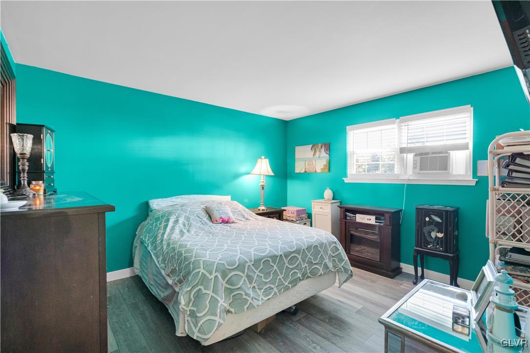 3248 Garrett Road Bethlehem, PA 18017 - Photo 23 of 40 a bedroom with a bed table and a flat screen tv