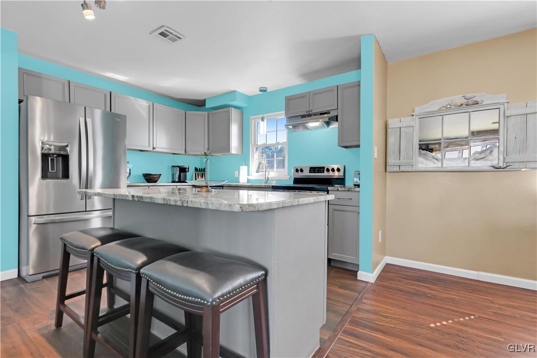 3248 Garrett Road Bethlehem, PA 18017 - Photo 3 of 40 a kitchen with granite countertop a refrigerator stove top oven and sink