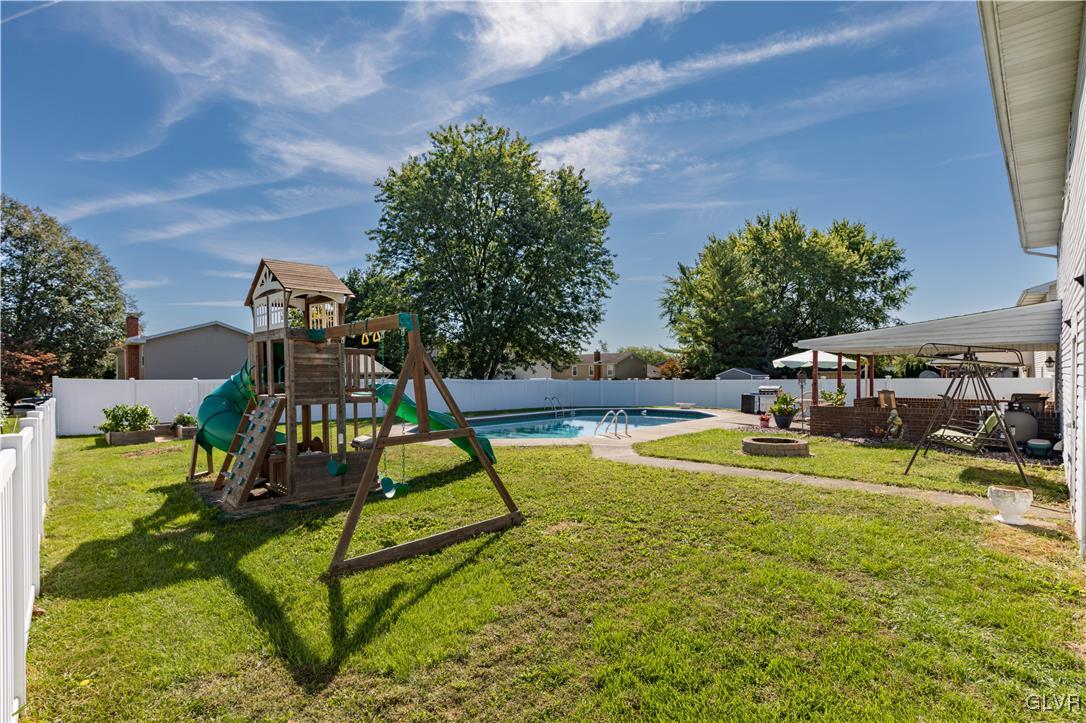 3248 Garrett Road Bethlehem, PA 18017 - Photo 32 of 40 a view of swimming pool with seating area and trees in the background