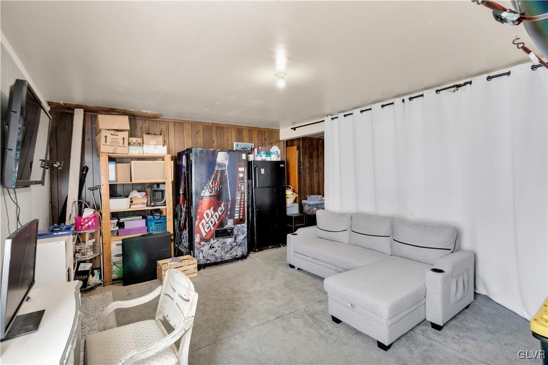 3248 Garrett Road Bethlehem, PA 18017 - Photo 34 of 40 a living room with furniture a ceiling fan and a rug