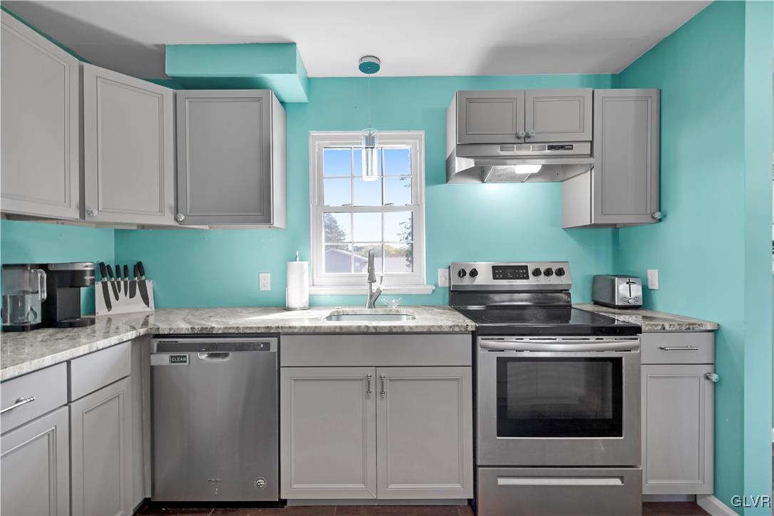 3248 Garrett Road Bethlehem, PA 18017 - Photo 4 of 40 a kitchen with granite countertop a sink stainless steel appliances and cabinets