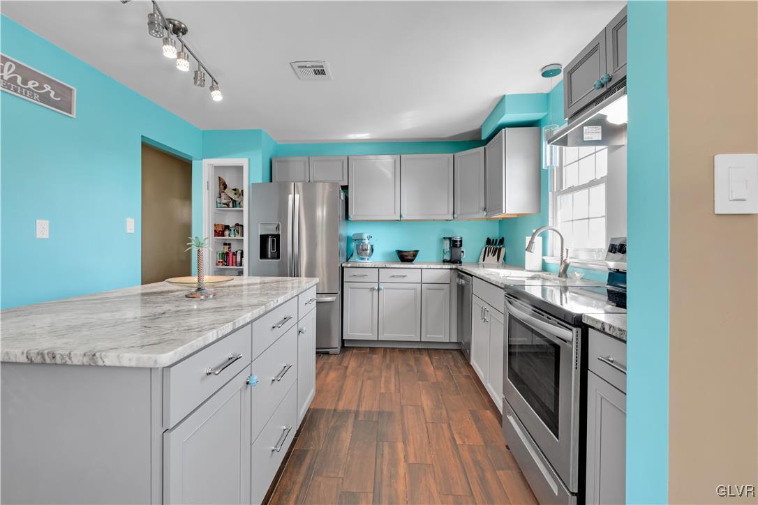 3248 Garrett Road Bethlehem, PA 18017 - Photo 5 of 40 a kitchen with a sink stove cabinets and refrigerator