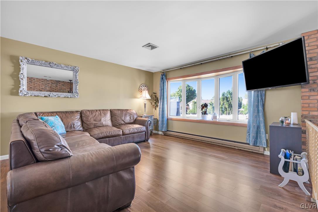 3248 Garrett Road Bethlehem, PA 18017 - Photo 8 of 40 a living room with furniture and a flat screen tv