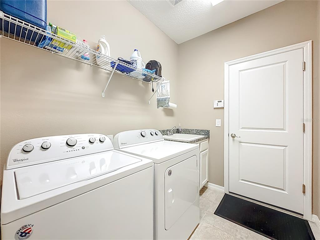 5647 Northwest 37th Lane Road Ocala, FL 34482 - Photo 21 of 50 a utility room with dryer and washer