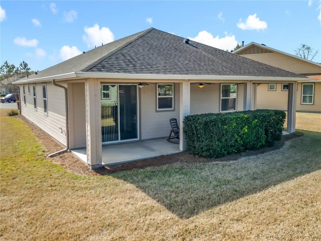 5647 Northwest 37th Lane Road Ocala, FL 34482 - Photo 23 of 50 a front view of a house with garden