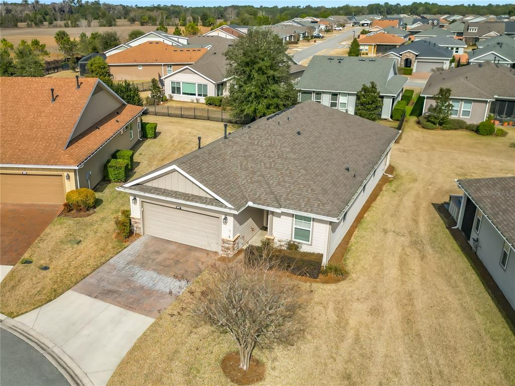 5647 Northwest 37th Lane Road Ocala, FL 34482 - Photo 27 of 50 an aerial view of a house with swimming pool and lake view