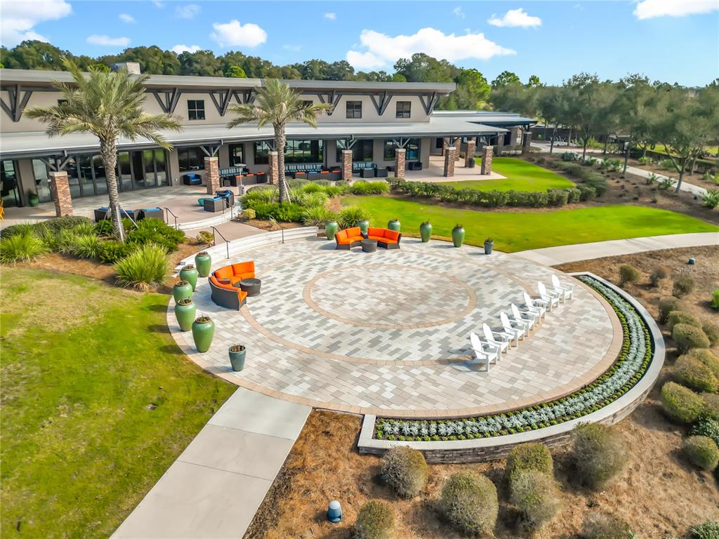 5647 Northwest 37th Lane Road Ocala, FL 34482 - Photo 35 of 50 a view of a swimming pool with a garden and plants