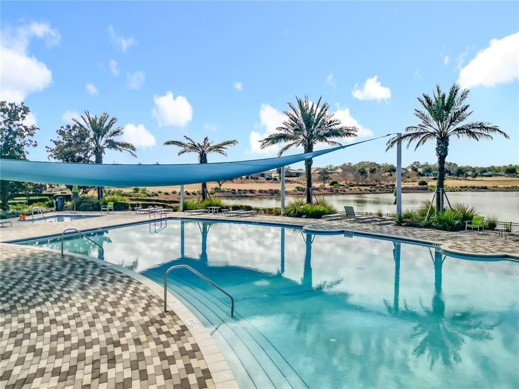 5647 Northwest 37th Lane Road Ocala, FL 34482 - Photo 36 of 50 a view of swimming pool with outdoor seating