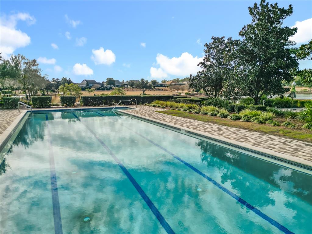 5647 Northwest 37th Lane Road Ocala, FL 34482 - Photo 40 of 50 a view of a lake with a yard