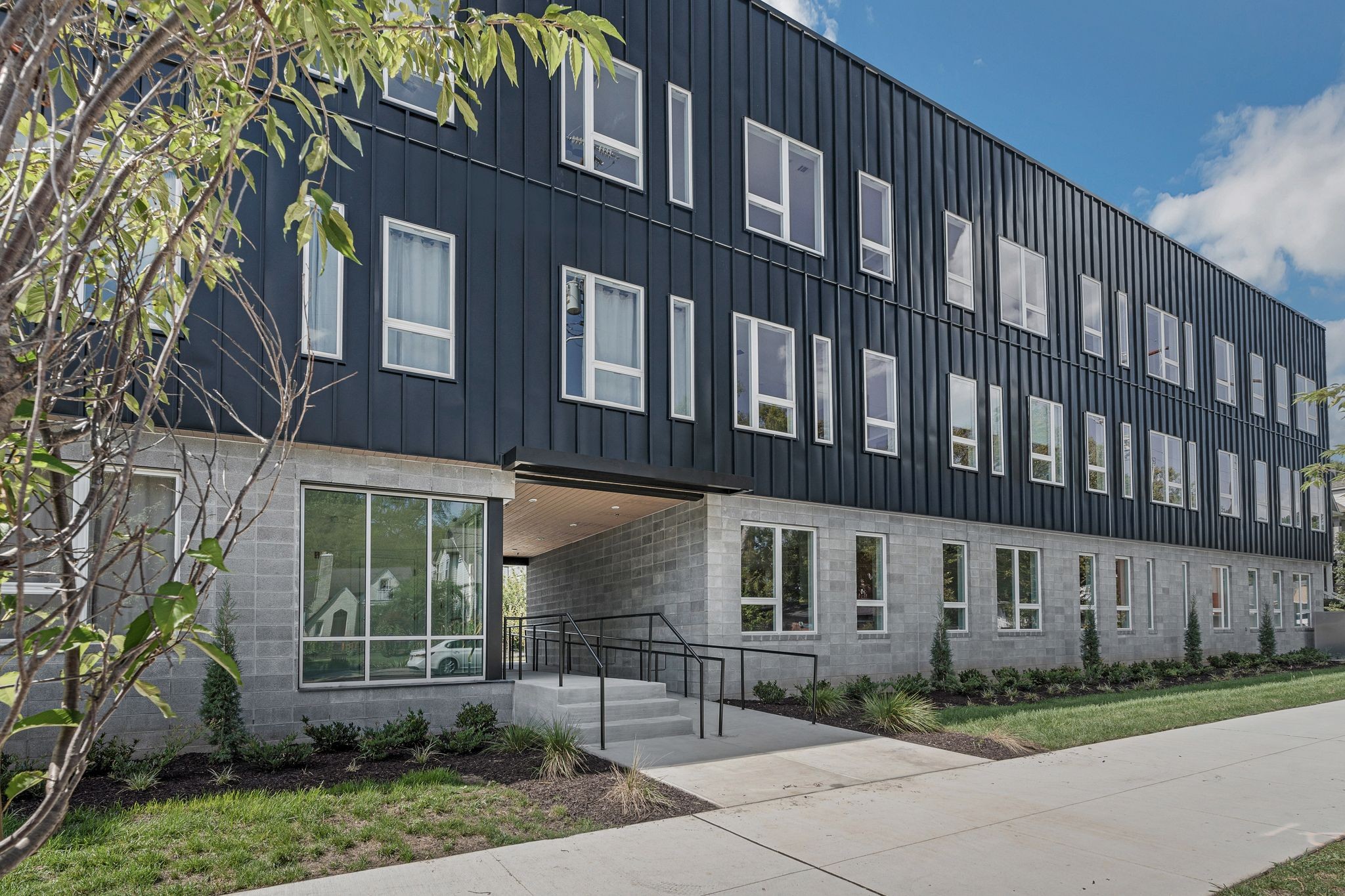 1310 Lischey Avenue, Unit 201 Nashville, TN 37207 - Photo 32 of 36 a front view of a building with garden