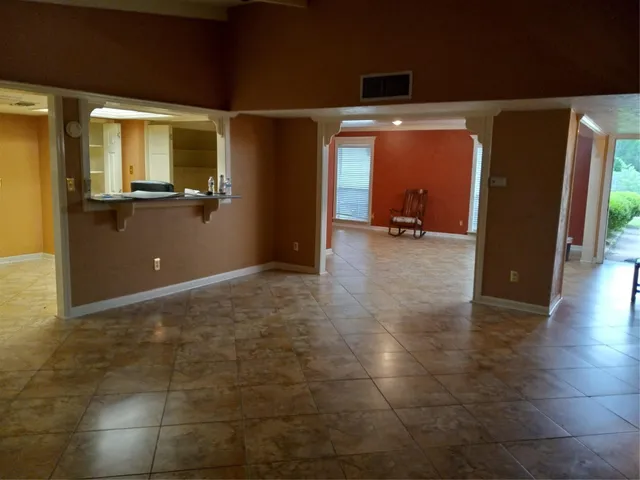 a kitchen with stainless steel appliances a stove a sink and a microwave
