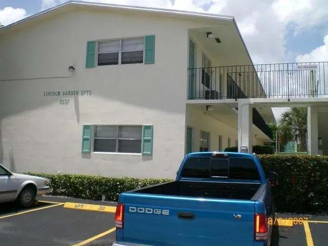 a front view of a house with parking space