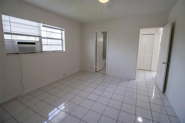 a view of an empty room with a window